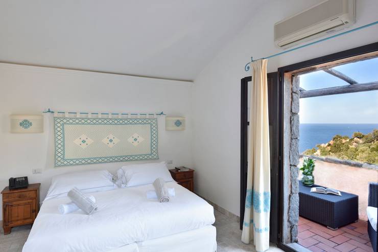 Deluxe double room with partial sea view sigillum cala moresca at arbatax park arbatax - sardinia Deluxe double room with partial sea view sigillum cala moresca at arbatax park arbatax - sardinia